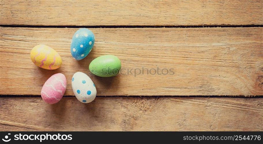 Panorama colorful easter egg group on wood background and texture with copy space.