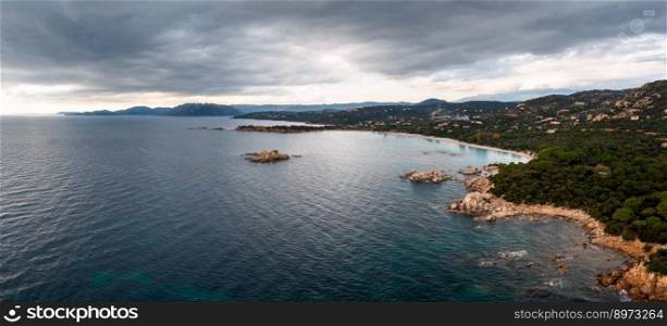 panorama drone view of Palombaggia Beach and hilly coastline in southeastern Corsica