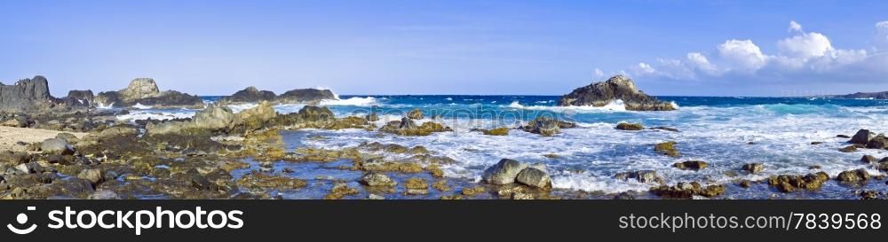 Panorama from the natural pool in the wild ocean on Aruba