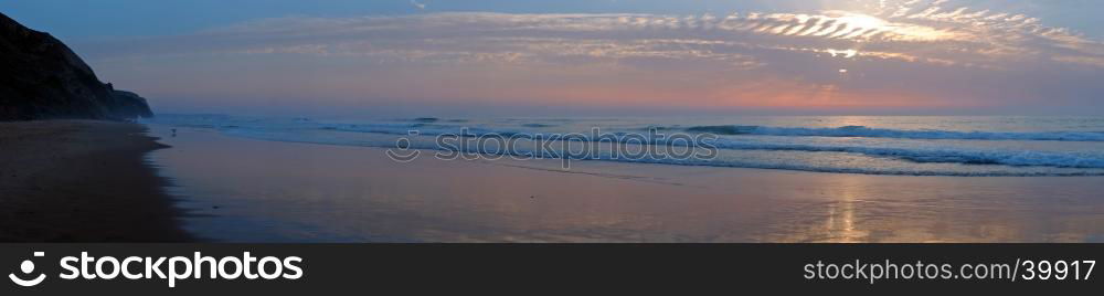 Panorama from Vale Figueiras beach in Portugal at sunset