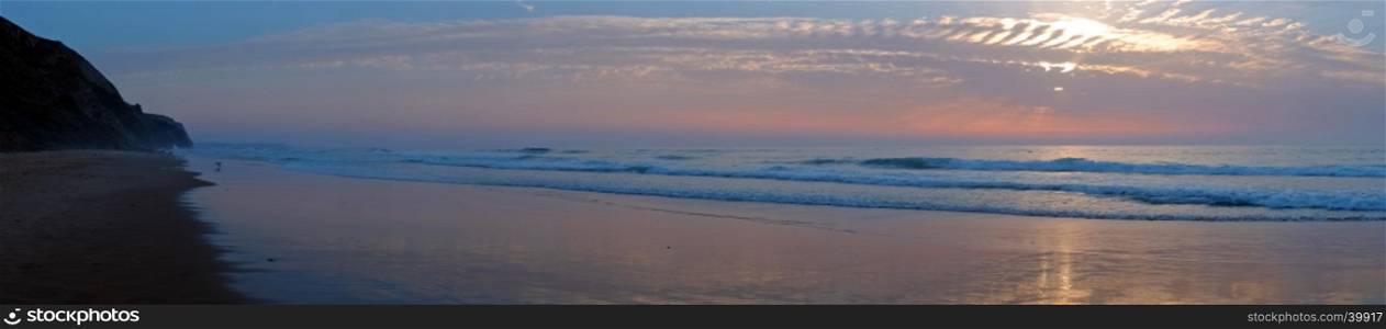 Panorama from Vale Figueiras beach in Portugal at sunset