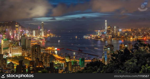 Panorama Hong Kong Cityscape skyscraper at twilight time, Hong Kong central and Kowloon island, Victoria peak and harbour, adventure and trekking at red incense burner summit view point for traveler