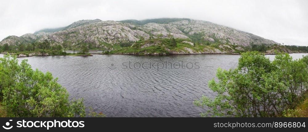 panorama Norway, Scandinavia. Beautiful landscape on the river shore middle of the stone mountains. 