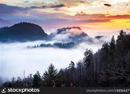 panorama of amazing foggy sunrise over mountains