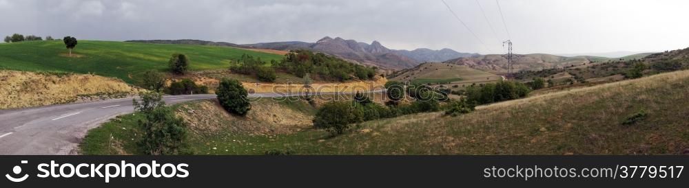 Panorama of asphalt road and farmland in Anatolia, Turkey