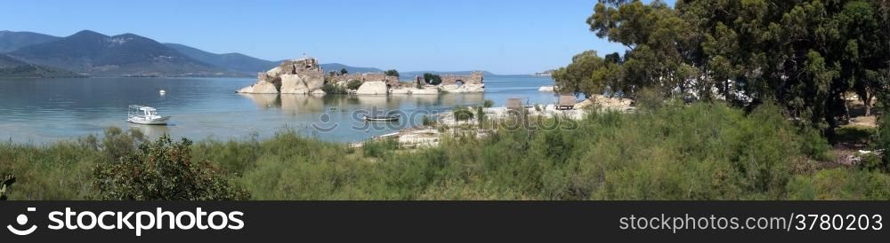 Panorama of Bafa lake with castle on the island, Turkey