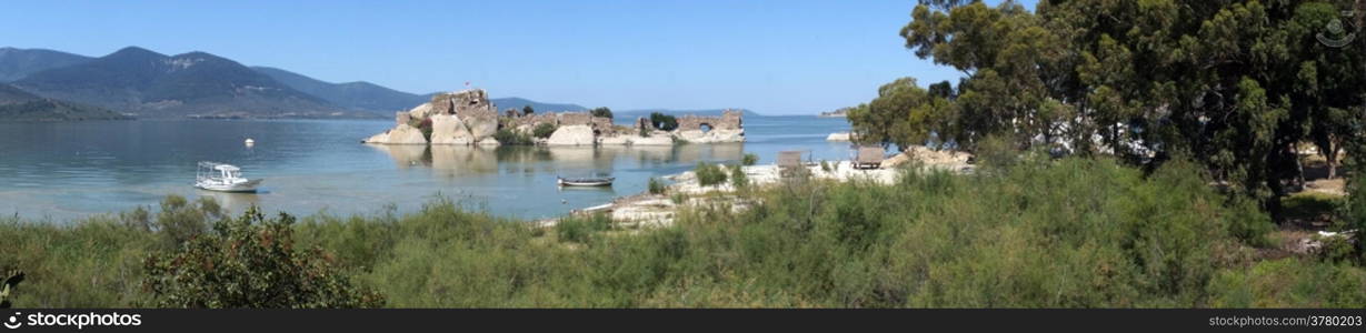 Panorama of Bafa lake with castle on the island, Turkey