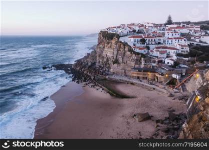 Panorama of beautiful houses on a rocky cliff at the coastal village of Azenhas Do Mar. Portugal