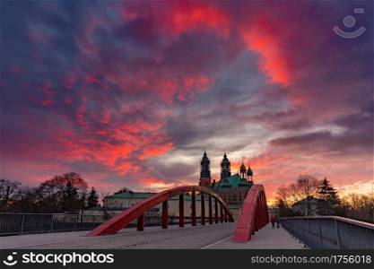 Panorama of Bishop Jordan Bridge over Cybina River and Poznan Cathedral at gorgeous sunset, Poznan, Poland.. Poznan Cathedral at sunset, Poland