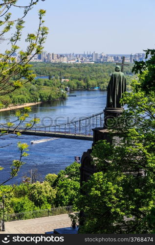 Panorama of city landscape and nature. Kiev, Ukraine. Green trees, architecture, bridges and blue river