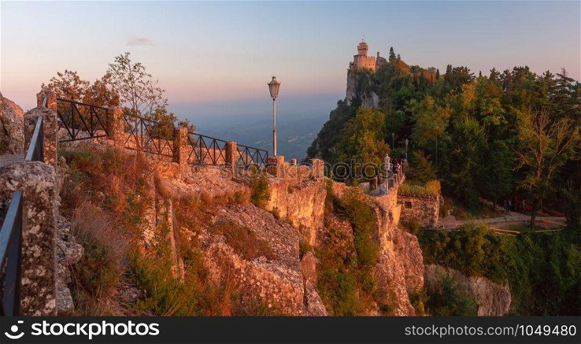 Panorama of De La Fratta or Cesta, Second Tower on Mount Titano, in city of San Marino of Republic of San Marino during gold hour at sunset. Cesta fortress in San Marino