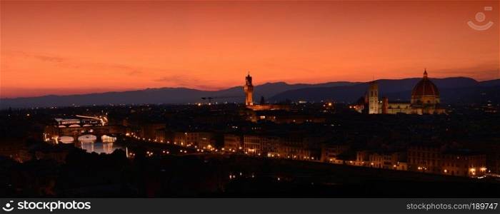 Panorama of Duomo Santa Maria Del Fiore, tower of Palazzo Vecchio and famous bridge Ponte Vecchio at sunset  in Florence, Tuscany, Italy