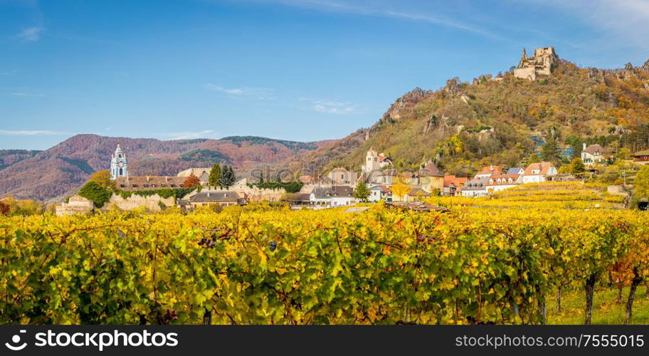 Panorama of Durnstein with ruin, church and vinyards in autumn, Wachau, Austria