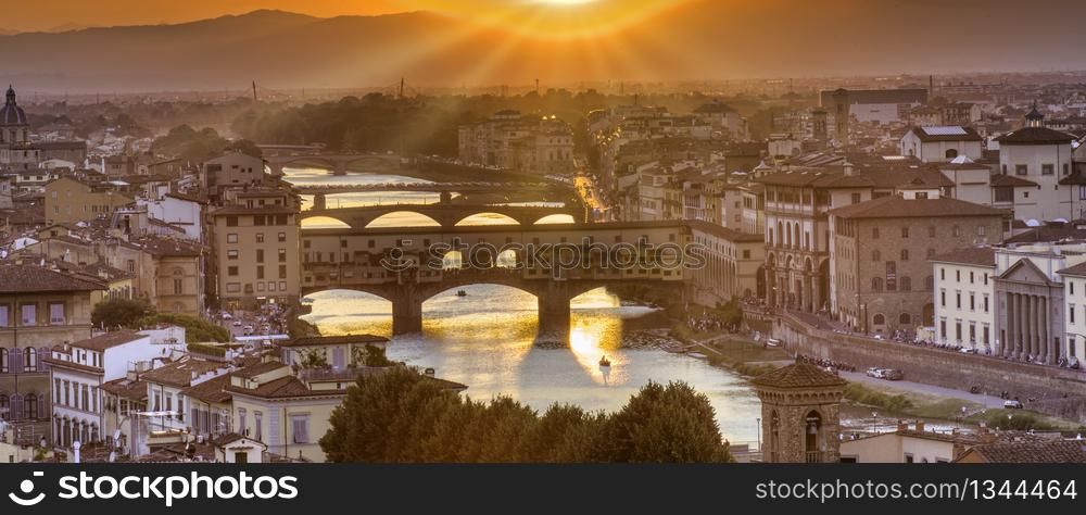 Panorama of famous bridge Ponte Vecchio at sunset in Florence, Tuscany, Italy