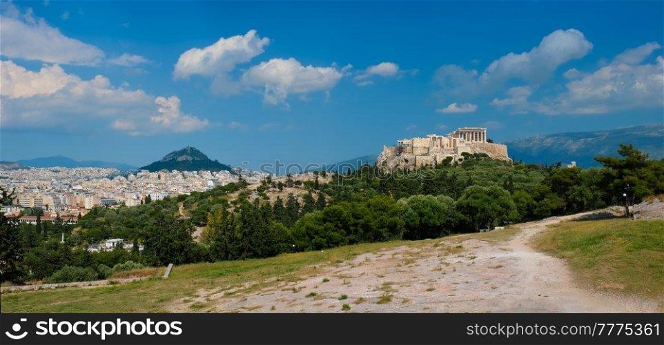 Panorama of famous greek tourist landmark - the iconic Parthenon Temple at the Acropolis of Athens as seen from Philopappos Hill, Athens, Greece. Iconic Parthenon Temple at the Acropolis of Athens, Greece