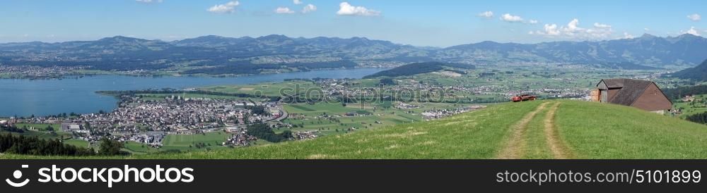 Panorama of farm fields and lake Zurich in Switzerland
