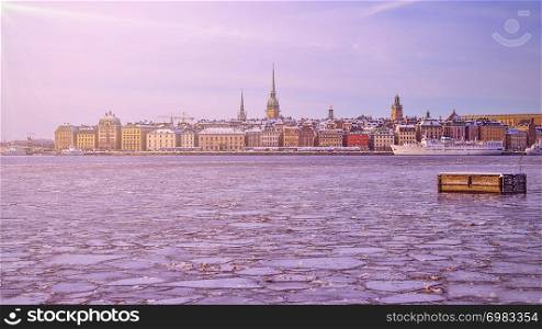 Panorama of Gamla Stan, Old Town in Stockholm, the capital of Sweden, during winter with ice shelves on the river
