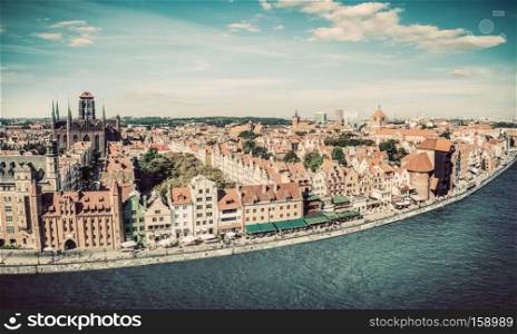 Panorama of Gdansk old town and Motlawa river in Poland. The city also known as Danzig and the city of amber. Vintage. Panorama of Gdansk old town and Motlawa river in Poland. Vintage
