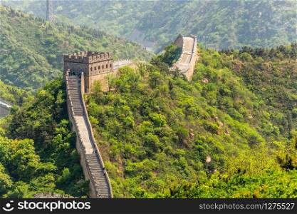 Panorama of Great Wall of China among the green hills and mountains near Beijing, China