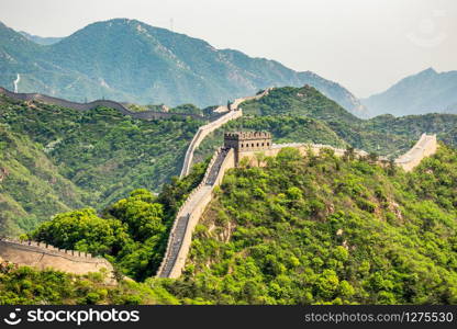 Panorama of Great Wall of China among the green hills and mountains near Beijing, China