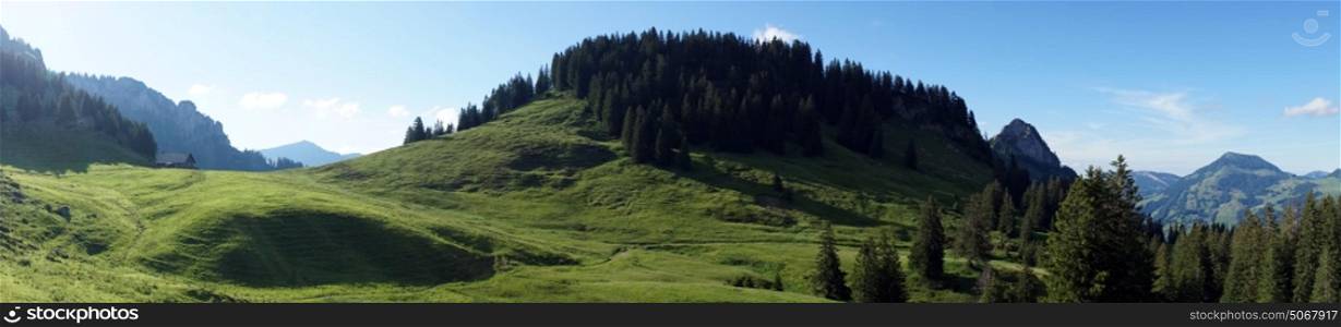 Panorama of green hills in mountain area of Switzerland