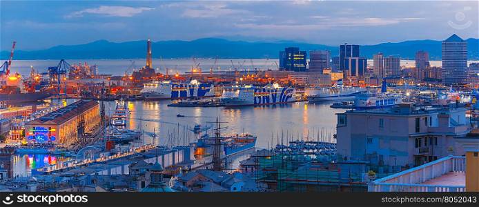 Panorama of Historical Lanterna old Lighthouse, container and passenger terminals in seaport of Genoa on Mediterranean Sea, at night, Italy.
