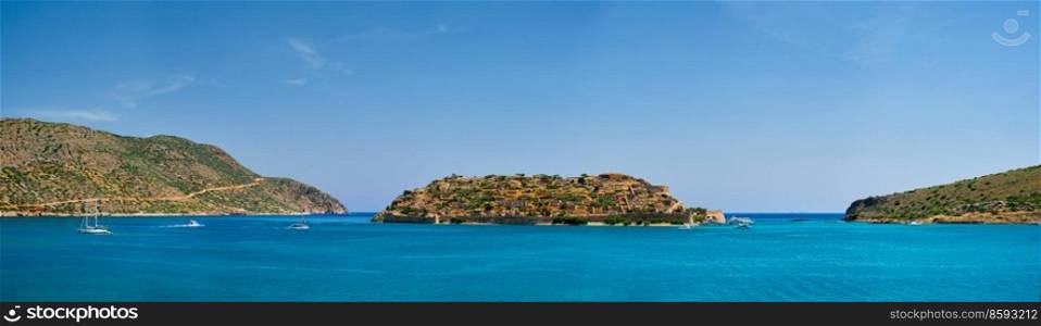 Panorama of Island of Spinalonga with old fortress former leper colony and the bay of Elounda, Crete island, Greece. Island of Spinalonga, Crete, Greece