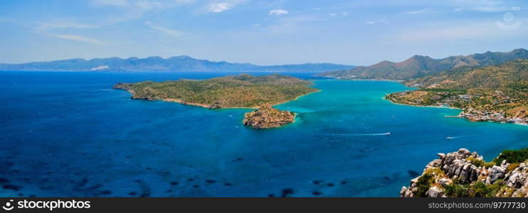 Panorama of Island of Spinalonga with old fortress former leper colony and the bay of Elounda, Crete island, Greece. Island of Spinalonga, Crete, Greece