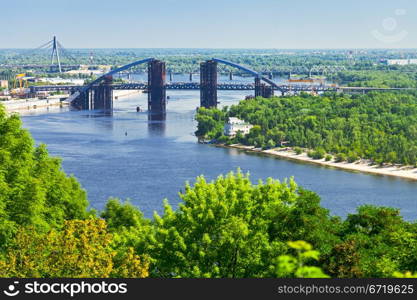 panorama of Kiev with Podilsko-Voskresenskyi Bridge on Dnieper River in Kiev, Ukraine