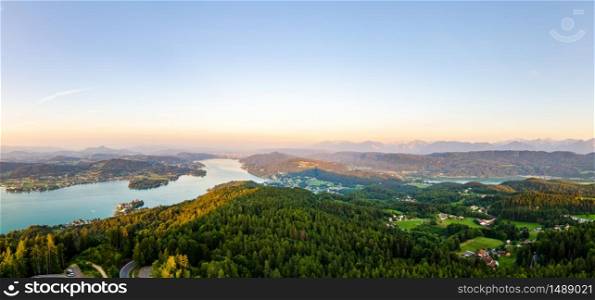 Panorama of Lake and mountains at Worthersee Karnten Austria. View from Pyramidenkogel tower on lake and Klagenfurt the area.. Panorama Lake and mountains at Worthersee Karnten Austria tourist spot