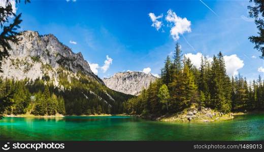 Panorama of Lake in Alps called Green Lake, Gruner See. Place to visit tourist destination. Sunny summer day in Styria, Austria. Green Lake panorama landscape in Styria, Austria. Gruner See place to visit tourist destination.