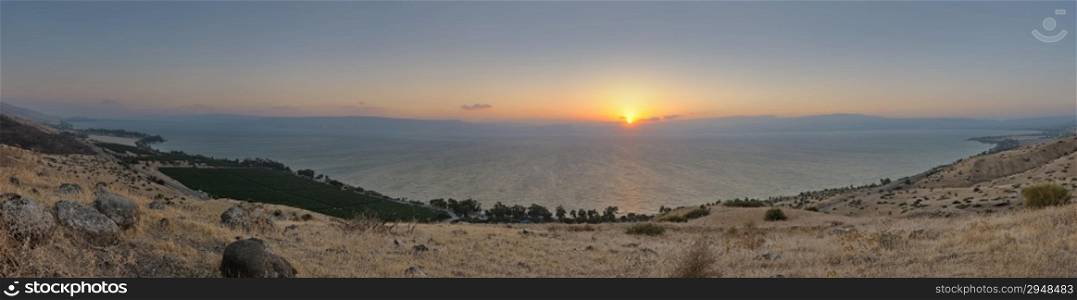 Panorama of Lake Kinneret at sunset from the slopes of the Golan Heights (Israel)