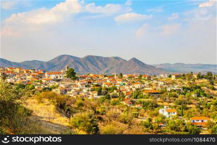 Panorama of Lefkara, traditional Cypriot village with red rooftop houses and mountains in the background, Larnaca district, Cyprus