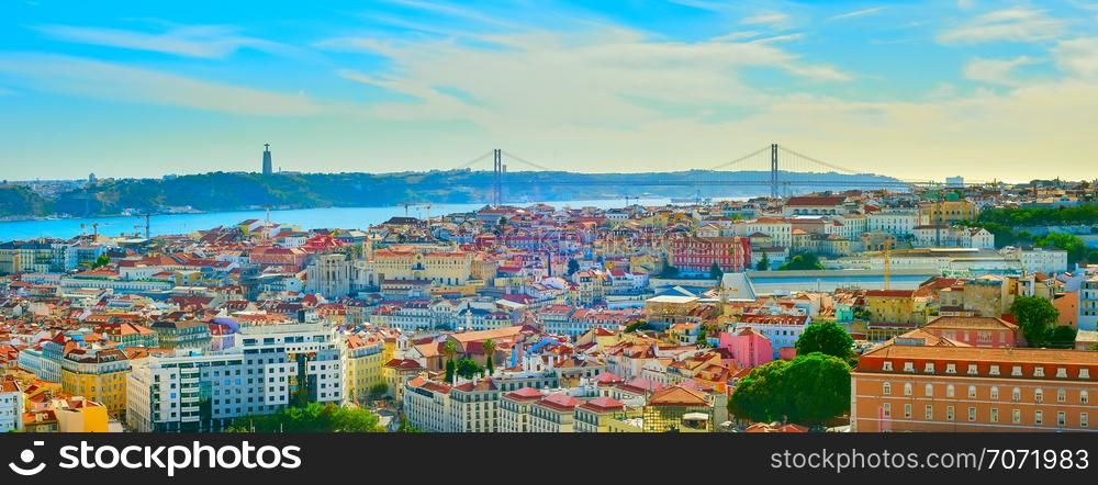 Panorama of Lisbon old town, 25th April Bridge and Christ the King statue on the Tagus river