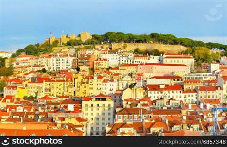 Panorama of Lisbon with Lisbon Castle on top of a hill at sunset. Portugal