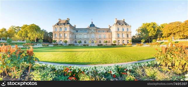 Panorama of Luxembourg garden with statues, flowers and building of Luxembourg Palace. Paris, France