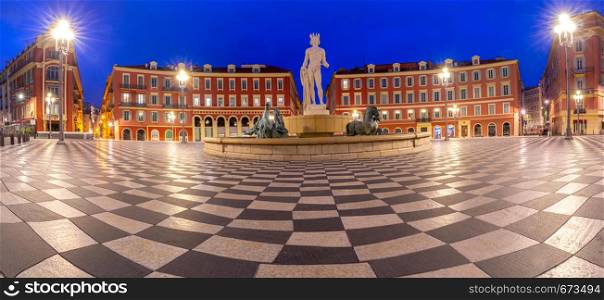 Panorama of Massena Square, the facades of old houses and a fountain at dawn. Nice. France.. Nice. Panorama of Massena Square and the fountain in the night lighting.