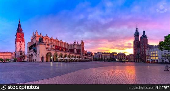 Panorama of Medieval Main market square with Basilica of Saint Mary, Cloth Hall and Town Hall Tower in Old Town of Krakow at sunrise, Poland. Main market square, Krakow, Poland