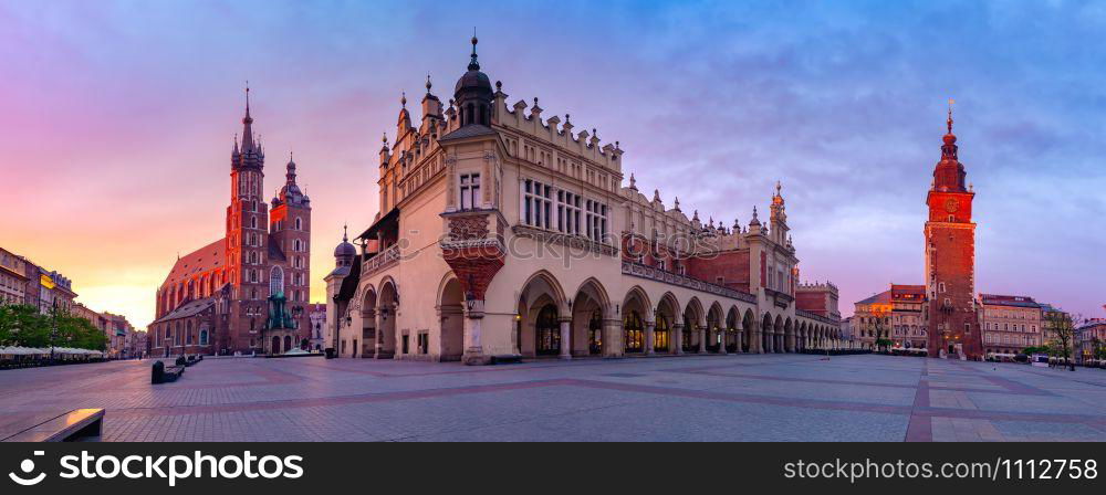 Panorama of Medieval Main market square with Basilica of Saint Mary, Cloth Hall and Town Hall Tower in Old Town of Krakow at sunrise, Poland. Main market square, Krakow, Poland