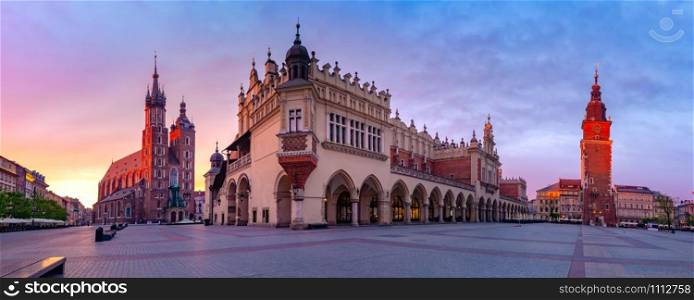 Panorama of Medieval Main market square with Basilica of Saint Mary, Cloth Hall and Town Hall Tower in Old Town of Krakow at sunrise, Poland. Main market square, Krakow, Poland