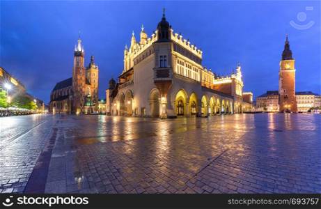 Panorama of Medieval Main market square with Basilica of Saint Mary, Cloth Hall and Town Hall Tower in Old Town of Krakow, Poland. Main market square, Krakow, Poland