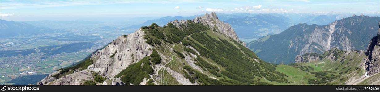 Panorama of mountain range with hiking trail in Lichtenstein