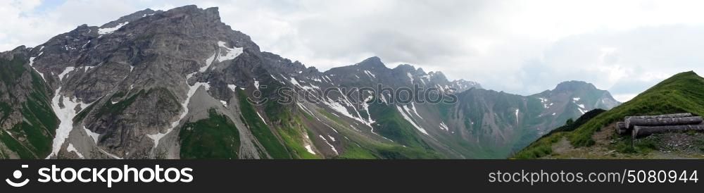 Panorama of mountain range with snow in Lichtenstein