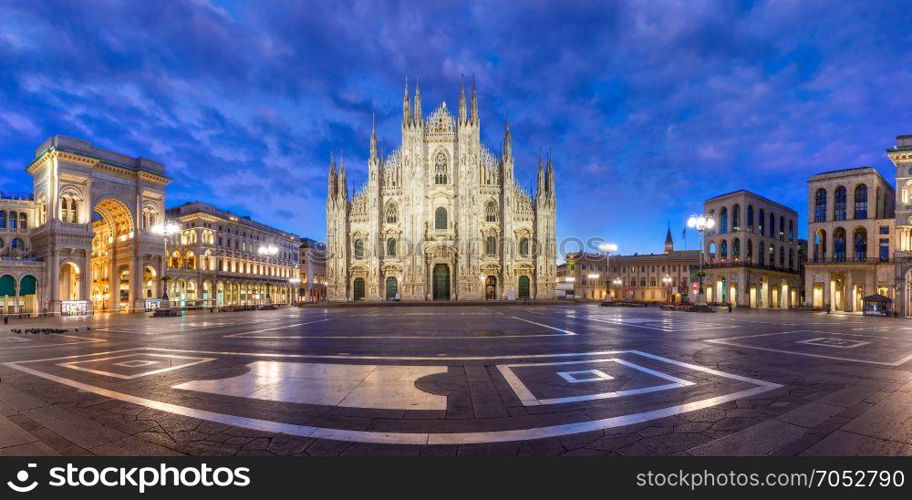 Panorama of night Piazza del Duomo in Milan, Italy. Panorama of the Piazza del Duomo, Cathedral Square, with Milan Cathedral or Duomo di Milano, Galleria Vittorio Emanuele II and Arengario, during morning blue hour, Milan, Lombardia, Italy