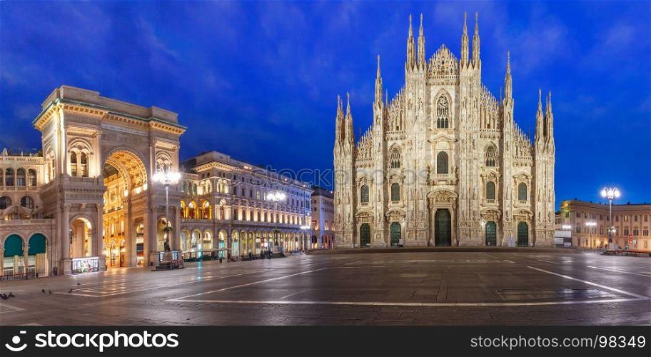 Panorama of night Piazza del Duomo in Milan, Italy. Panorama of the Piazza del Duomo, Cathedral Square, with Milan Cathedral or Duomo di Milano and Galleria Vittorio Emanuele II, during morning blue hour, Milan, Lombardia, Italy