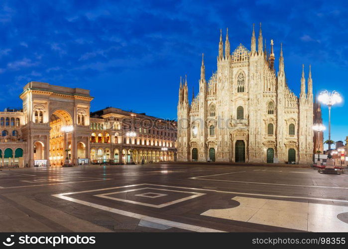 Panorama of night Piazza del Duomo in Milan, Italy. Panorama of the Piazza del Duomo, Cathedral Square, with Milan Cathedral or Duomo di Milano and Galleria Vittorio Emanuele II, during morning blue hour, Milan, Lombardia, Italy