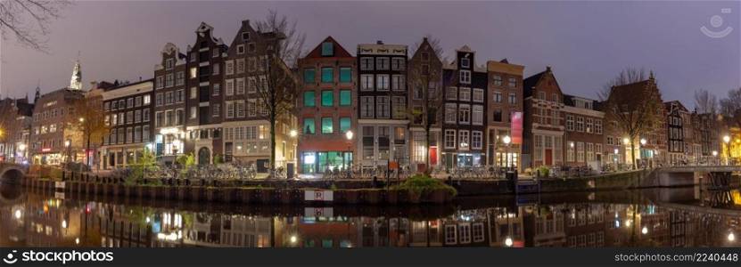 Panorama of old houses along the canal in the red light district. Amsterdam. Netherlands.. Amsterdam. Facades of old houses in the red light district.