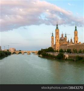 Panorama of Our Lady of the Pillar Basilica with Ebro River at dusk Zaragoza, Spain