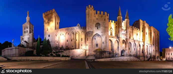 Panorama of palace of the Popes, once fortress and palace, one of largest and important medieval Gothic buildings in Europe, at night, Avignon, France. Palace of the Popes, Avignon, France