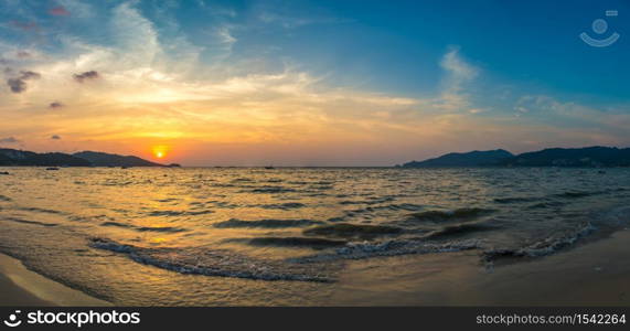 Panorama of Patong beach and Andaman sea on Phuket in Thailand during sunset